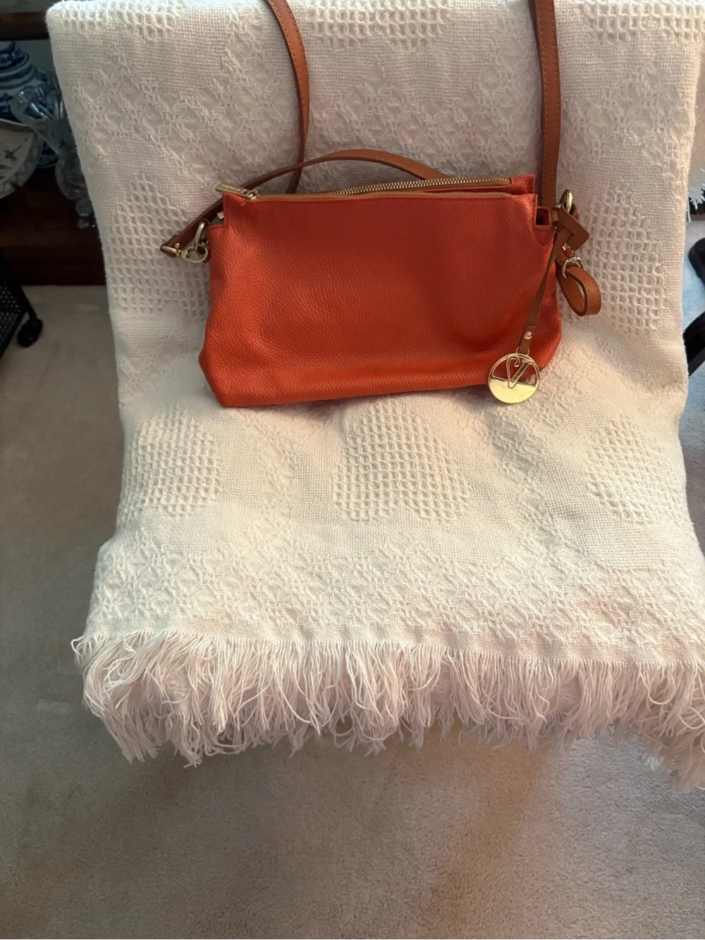 Valentino Garavani Vibrant Orange Leather Crossbody with Gold Charm
